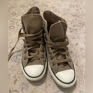 Brown converse high tops.